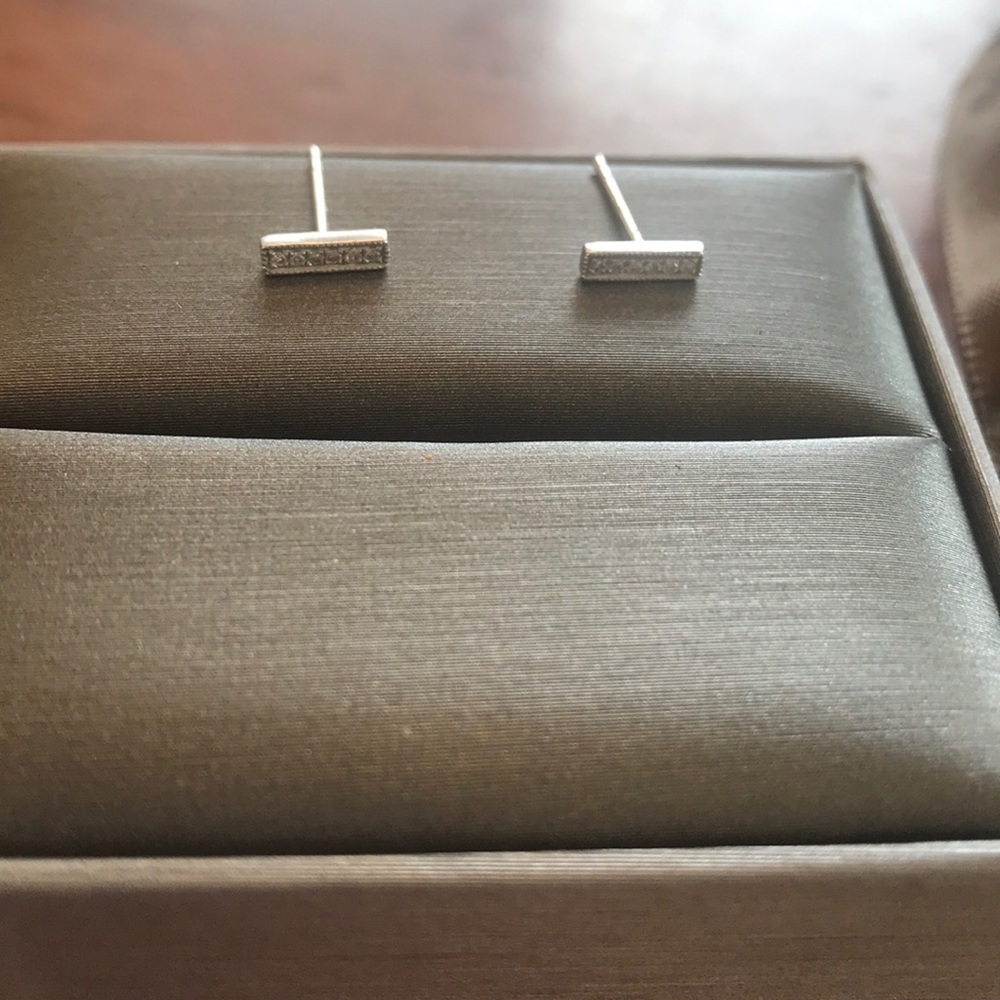 White 14 k gold bar diamond earrings.